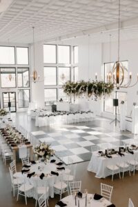 An inspirational black and white wedding featuring white wood chairs and a white wood bar for Ace Party and Tent Rental new products in New York.