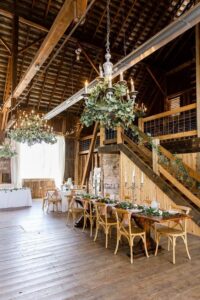 An inspirational photo by loren jackson photography of a rustic wedding featuring natural wood chairs and a brown wood bar for Ace Party and Tent Rental new products in New York. 